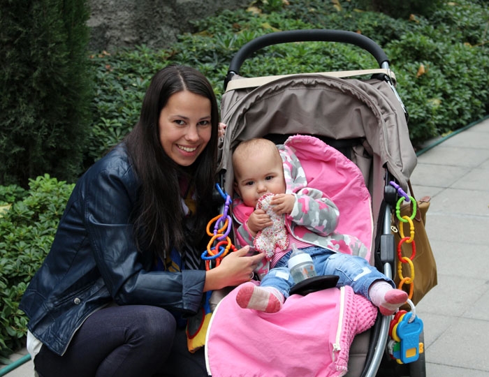 overseas au pair taking baby for a walk